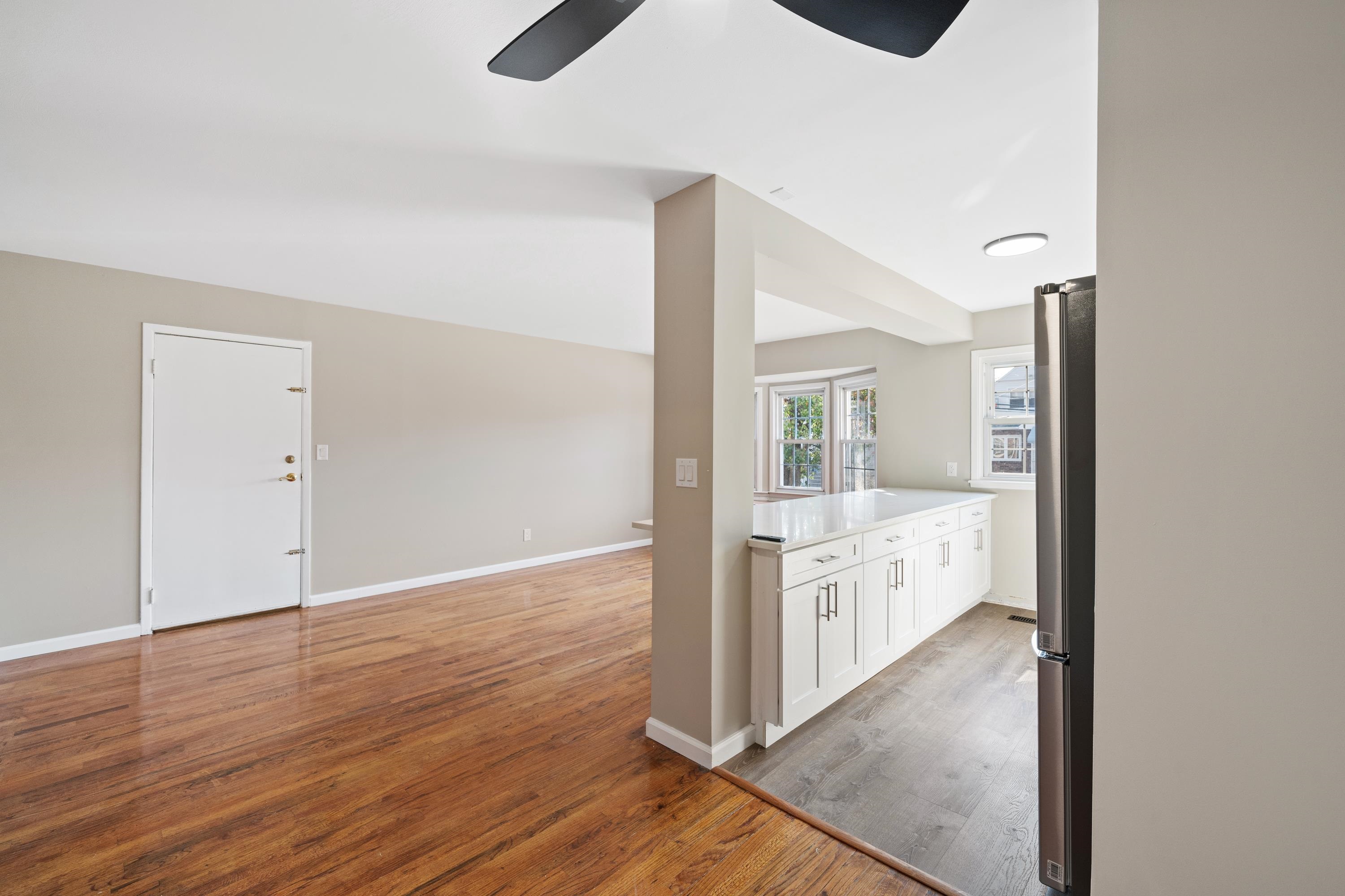 14 Delmar Road Jersey City, NJ 07305 - Photo 7 of 38 an empty room with wooden floor and windows