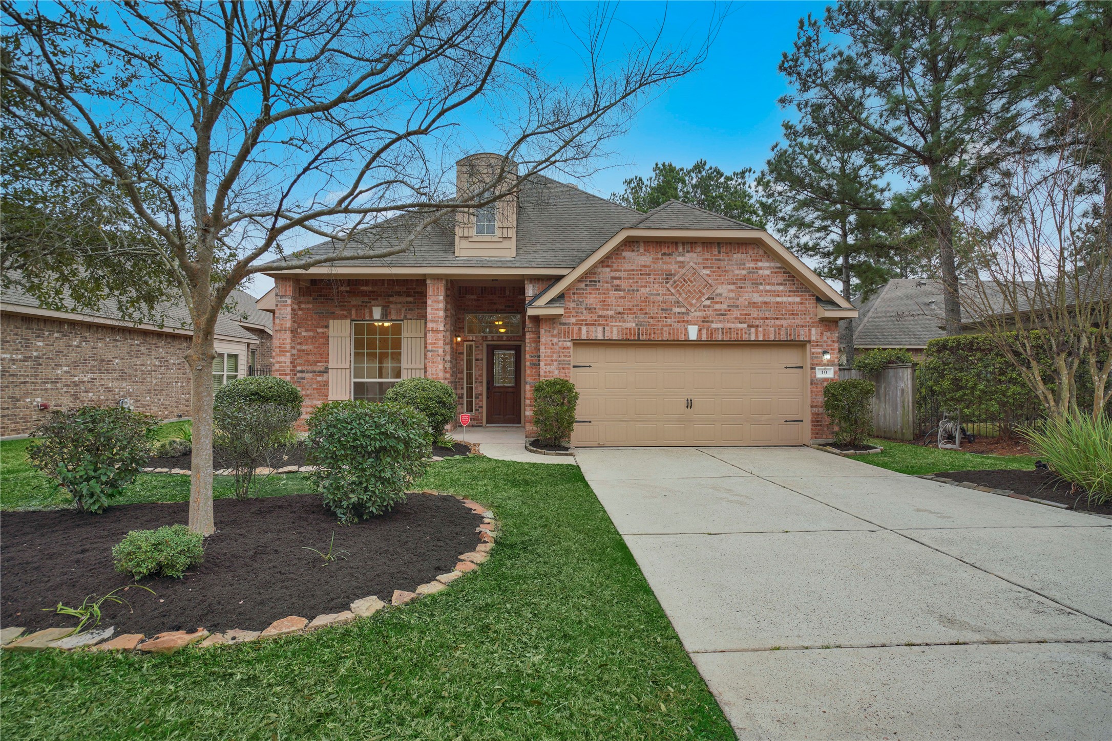 10 Tallgrass Way Spring, TX 77389 - Photo 1 of 23 a front view of house with yard and green space