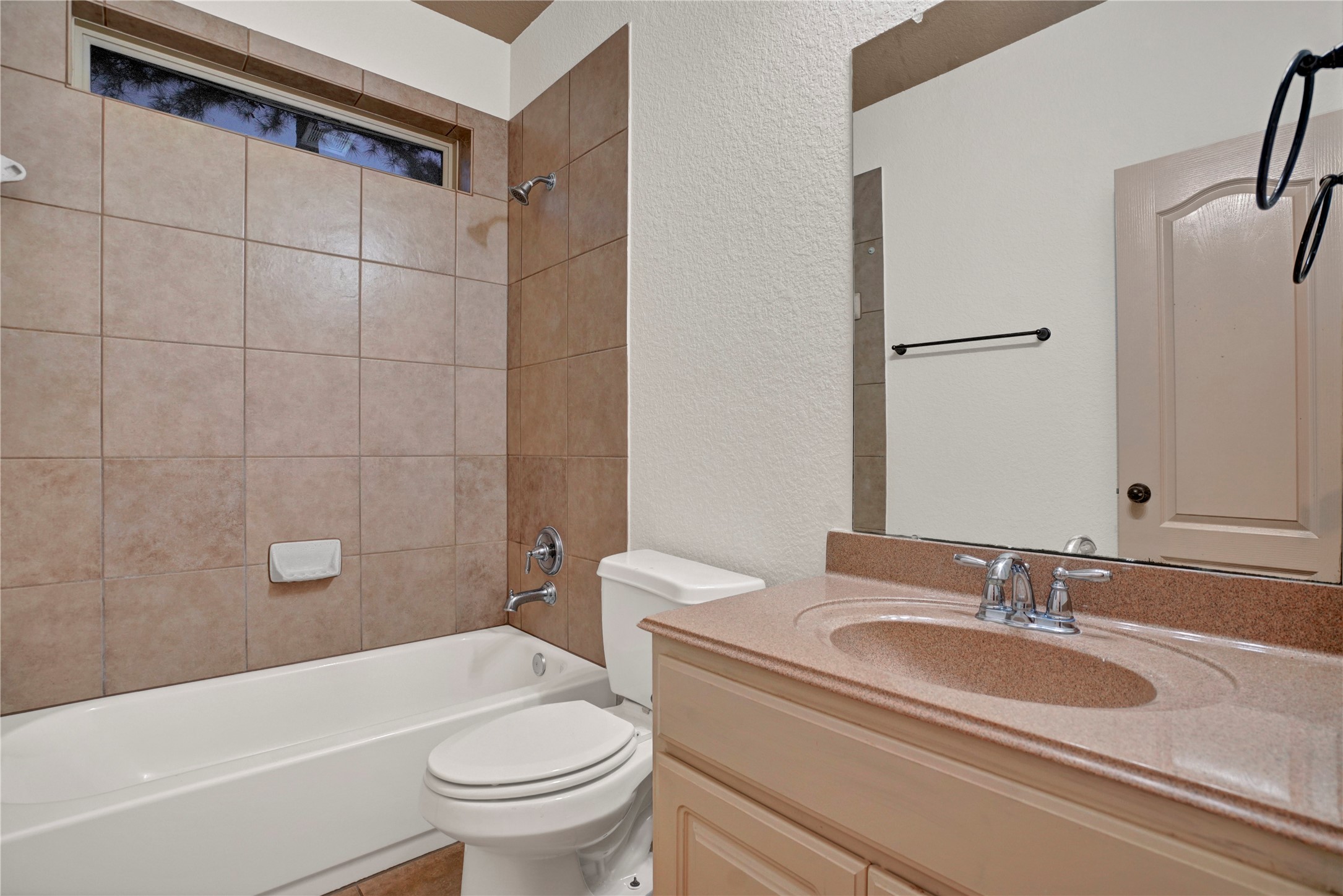 10 Tallgrass Way Spring, TX 77389 - Photo 18 of 23 a bathroom with a sink a toilet and a bathtub