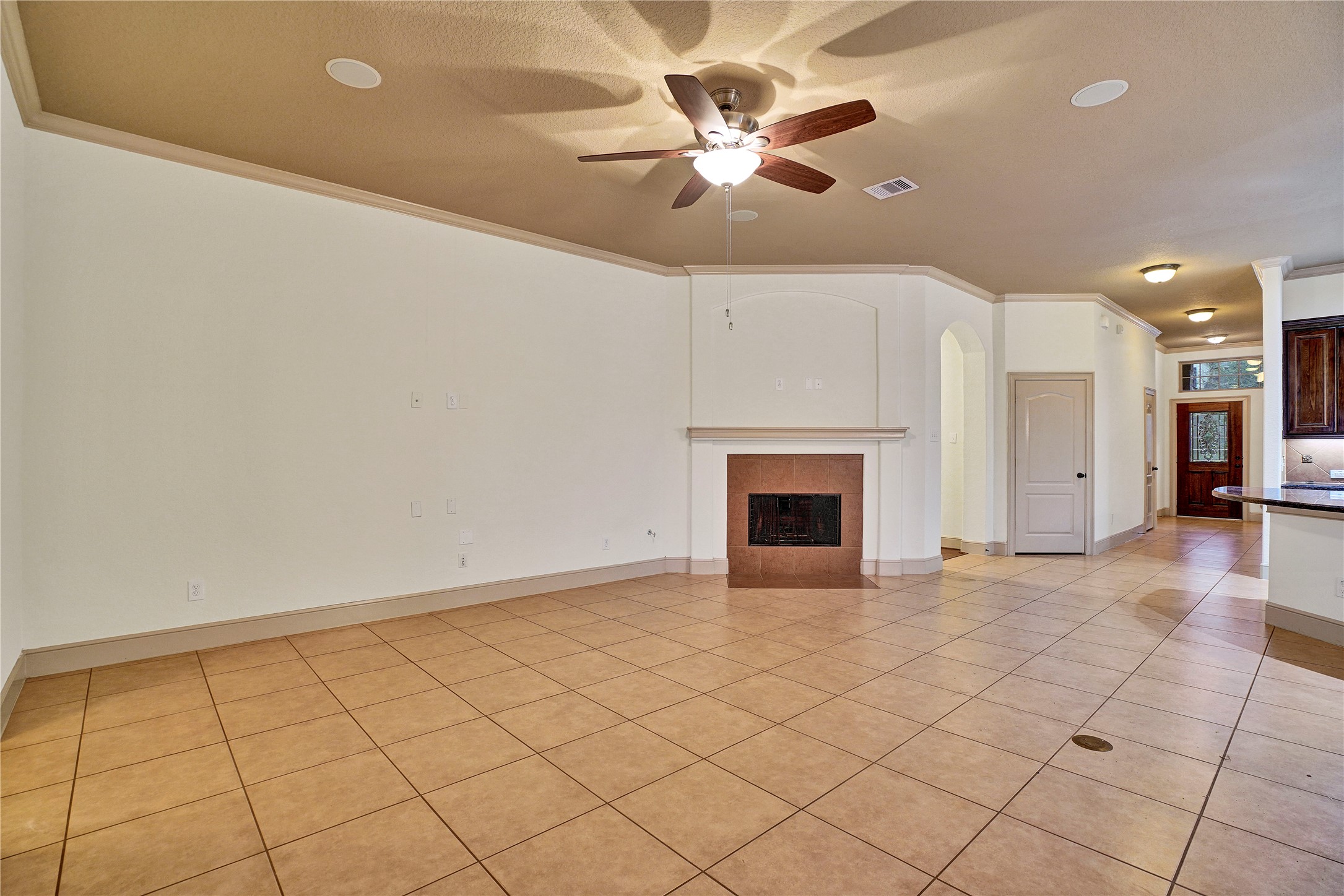 10 Tallgrass Way Spring, TX 77389 - Photo 6 of 23 an empty room with windows and fan