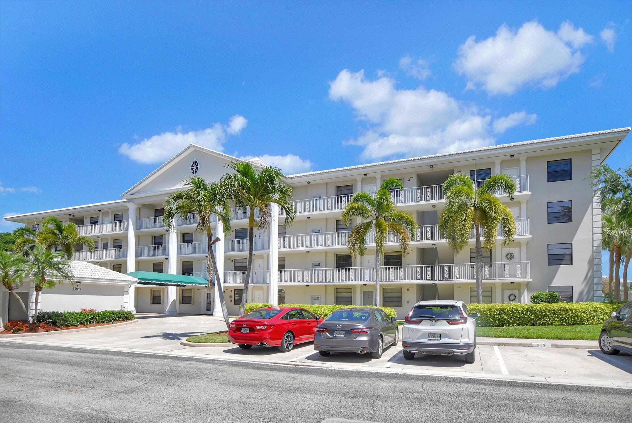 6025 Balboa Circle, Unit 303 Boca Raton, FL 33433 - Photo 1 of 23 a front view of a building with street view