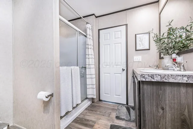 a bathroom with a sink and mirror