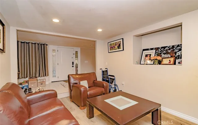 a living room with furniture and a night stand