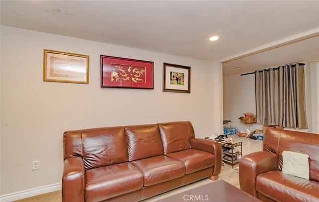 a blue couch sitting in a living room with a couch