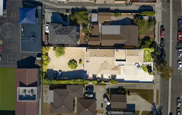 an aerial view of houses with outdoor space