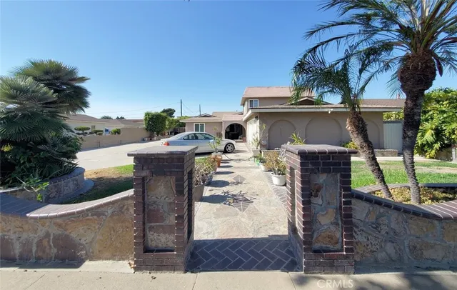 a view of a patio with table and chairs potted plants with wooden floor