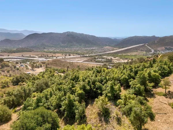 a view of a town with mountains in the background
