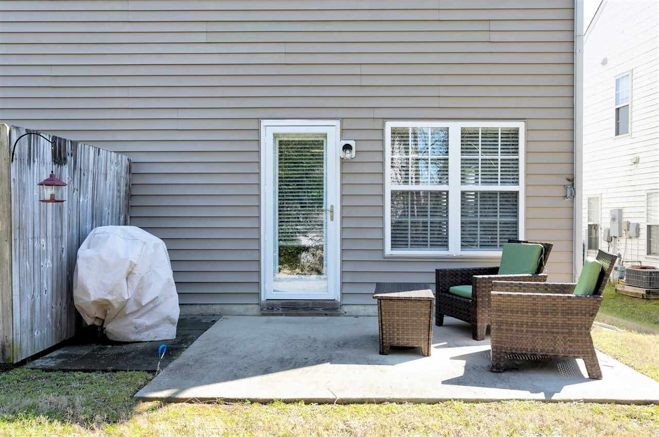 2049 Persimmon Ridge Drive Raleigh, NC 27604 - Photo 11 of 15 Break out the grill and enjoy the outdoor space of this beautiful town home. Vinyl exterior and HOA maintained exterior makes living here a carefree lifestyle. Spend more time enjoying life, and less time doing home repairs! Patio