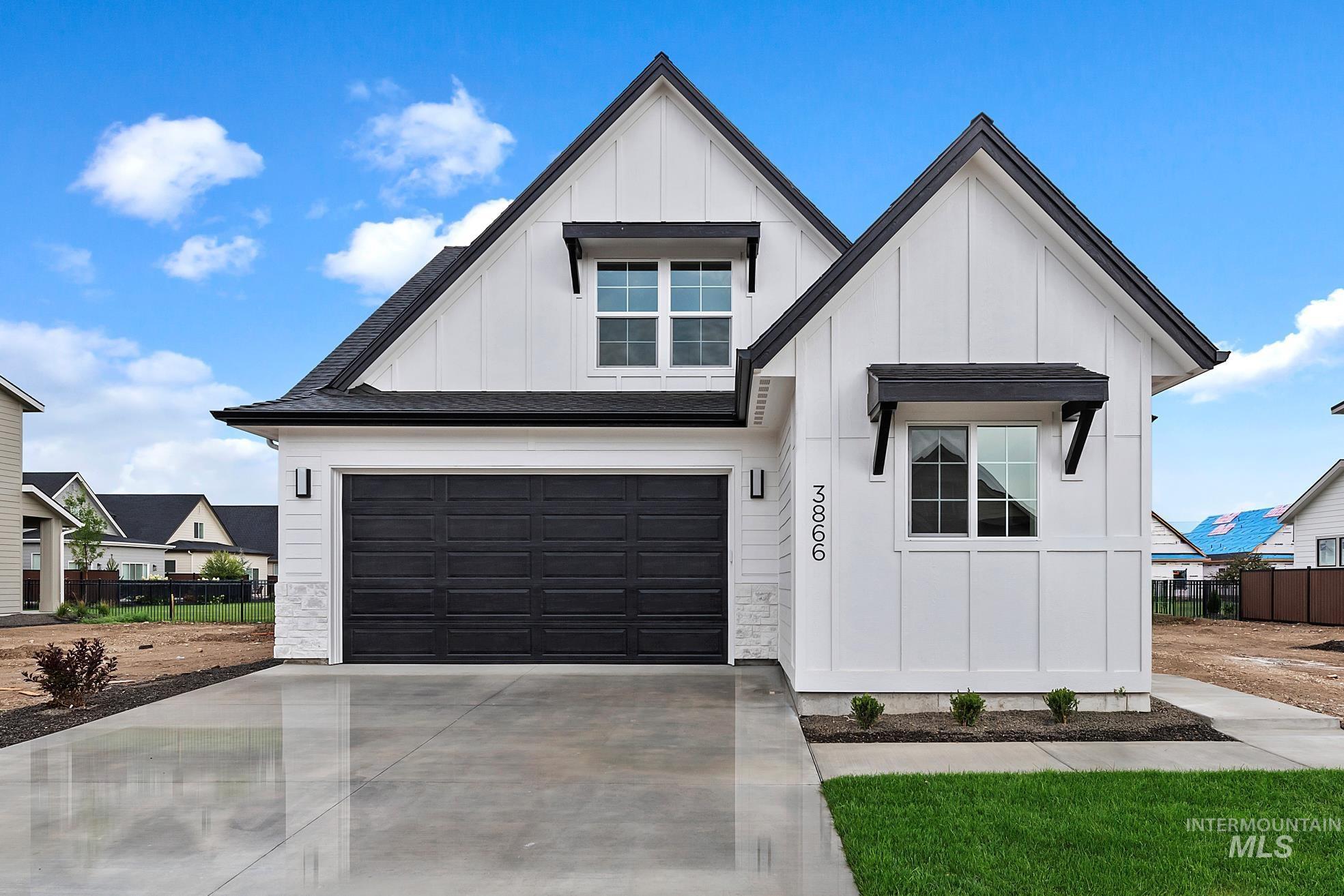 3866 West Spring House Lane Eagle, ID 83616 - Photo 2 of 33 View of front of home with driveway and board and batten siding