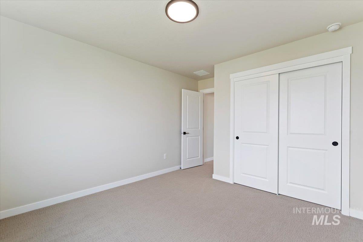 3866 West Spring House Lane Eagle, ID 83616 - Photo 20 of 33 Unfurnished bedroom with carpet flooring and a closet