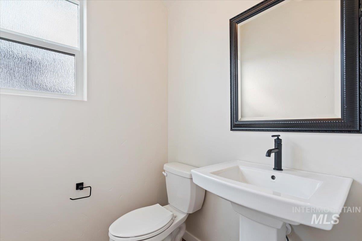 3866 West Spring House Lane Eagle, ID 83616 - Photo 24 of 33 Half bathroom featuring toilet and a sink