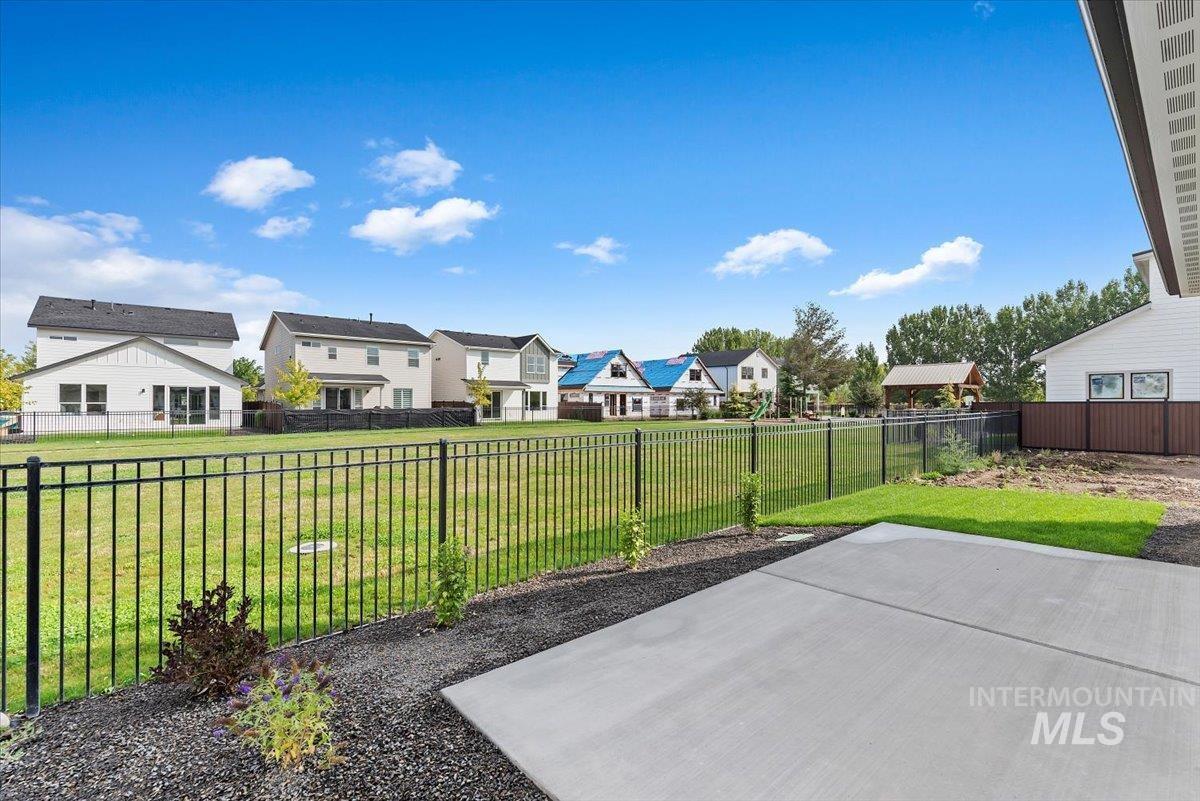 3866 West Spring House Lane Eagle, ID 83616 - Photo 29 of 33 Fenced backyard featuring a residential view and a patio area