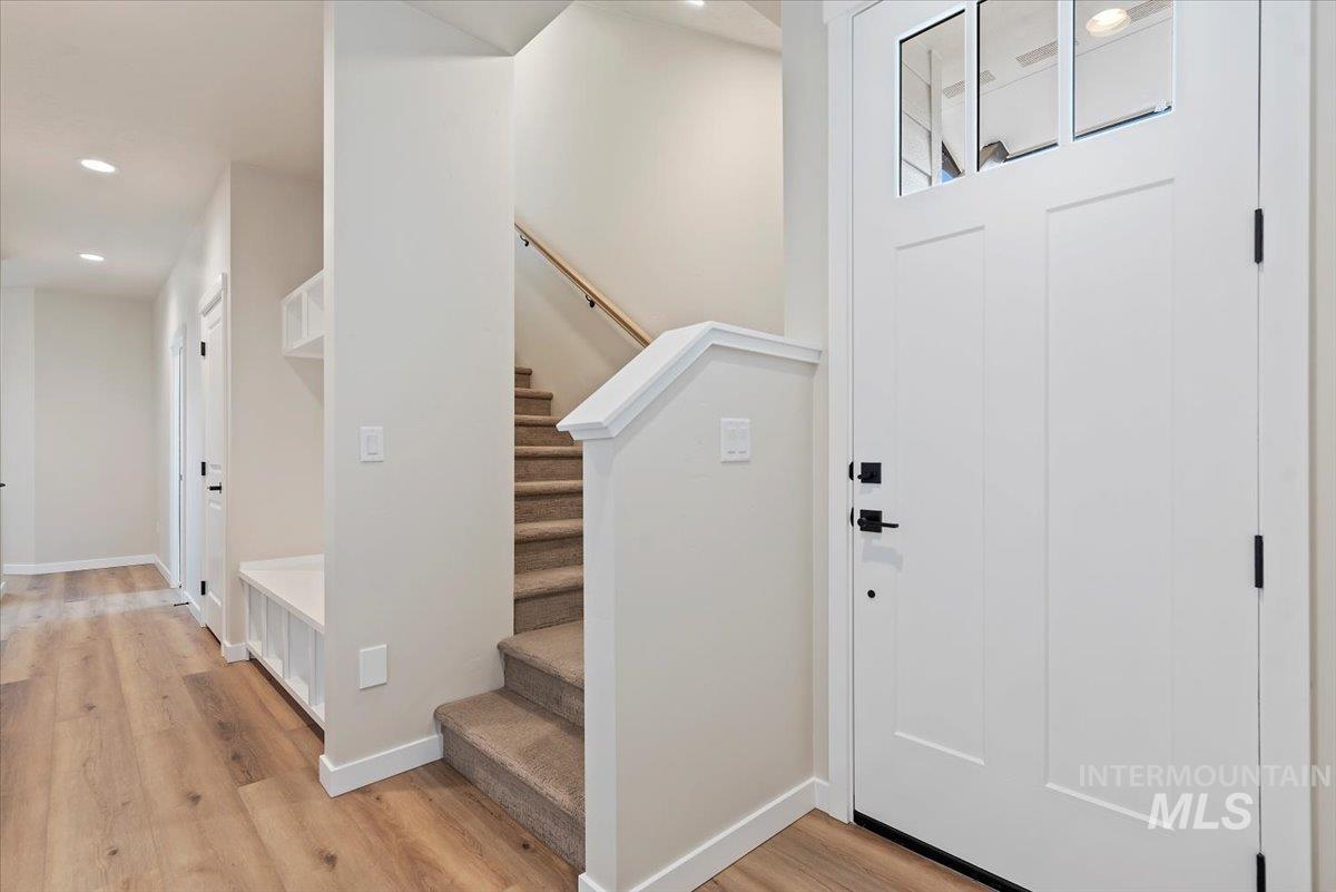 3866 West Spring House Lane Eagle, ID 83616 - Photo 4 of 33 Entrance foyer with stairs, light wood-style floors, and recessed lighting