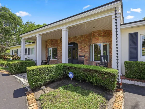front view of house with a garden