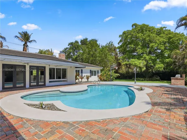 a kitchen with a microwave and cabinets