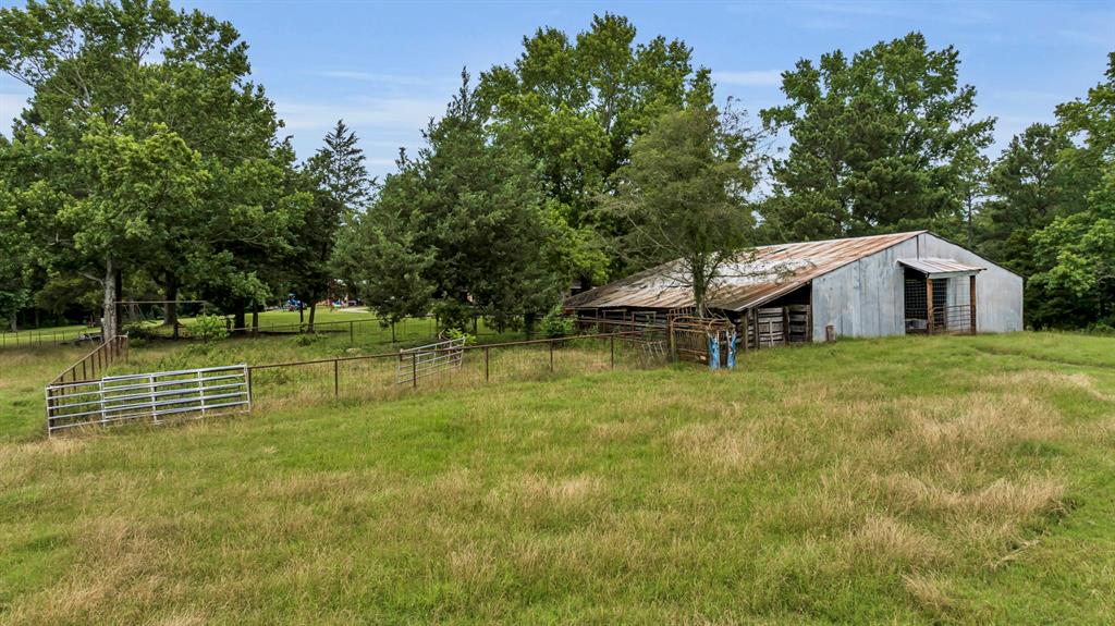 9822 Nasturtium Road Ore City, TX 75683 - Photo 15 of 37 a view of a house with a yard