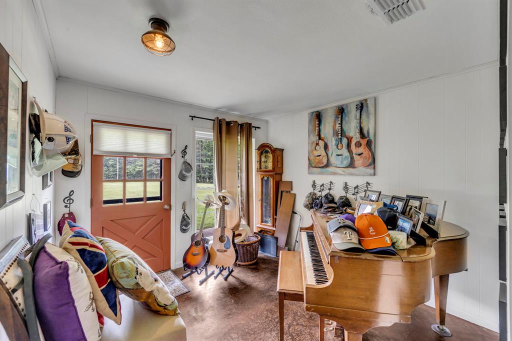 9822 Nasturtium Road Ore City, TX 75683 - Photo 17 of 37 a view of a room with gym equipment