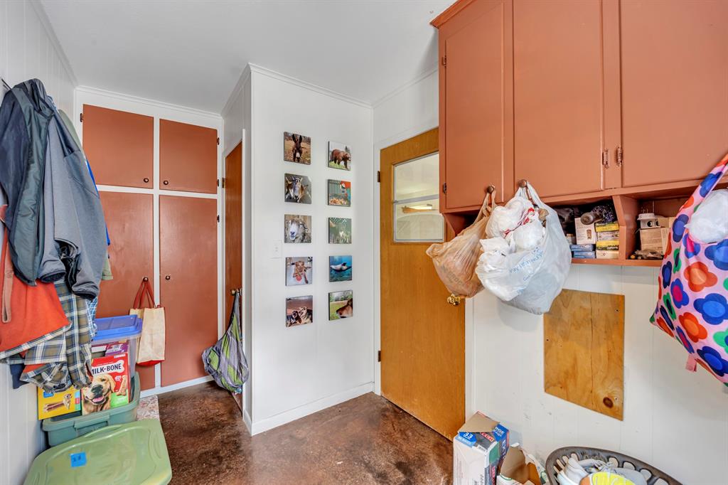 9822 Nasturtium Road Ore City, TX 75683 - Photo 34 of 37 a view of walk in closet with clothes and shoes