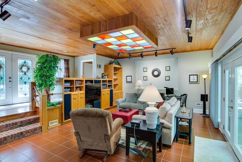 721 Tri Cities Farm Road Winchester, TN 37398 - Photo 5 of 30 Sunken Living Room w/wood ceilings, built in cabinets, track lighting, wood burning fireplace, and more