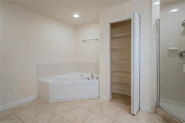 a bathroom with a bathtub and a shower