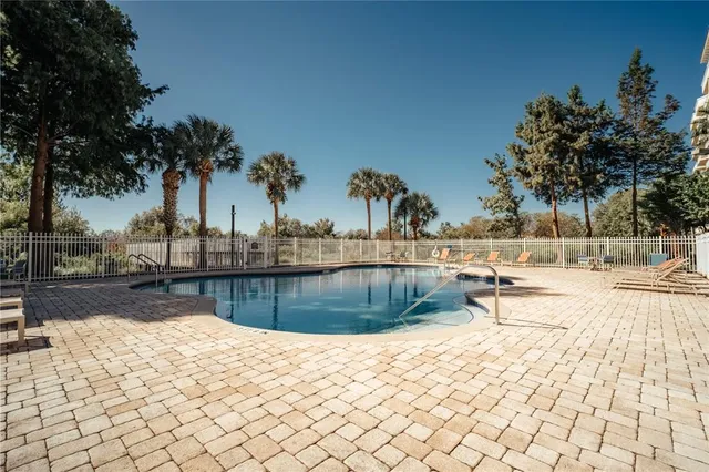 a view of swimming pool with sitting area