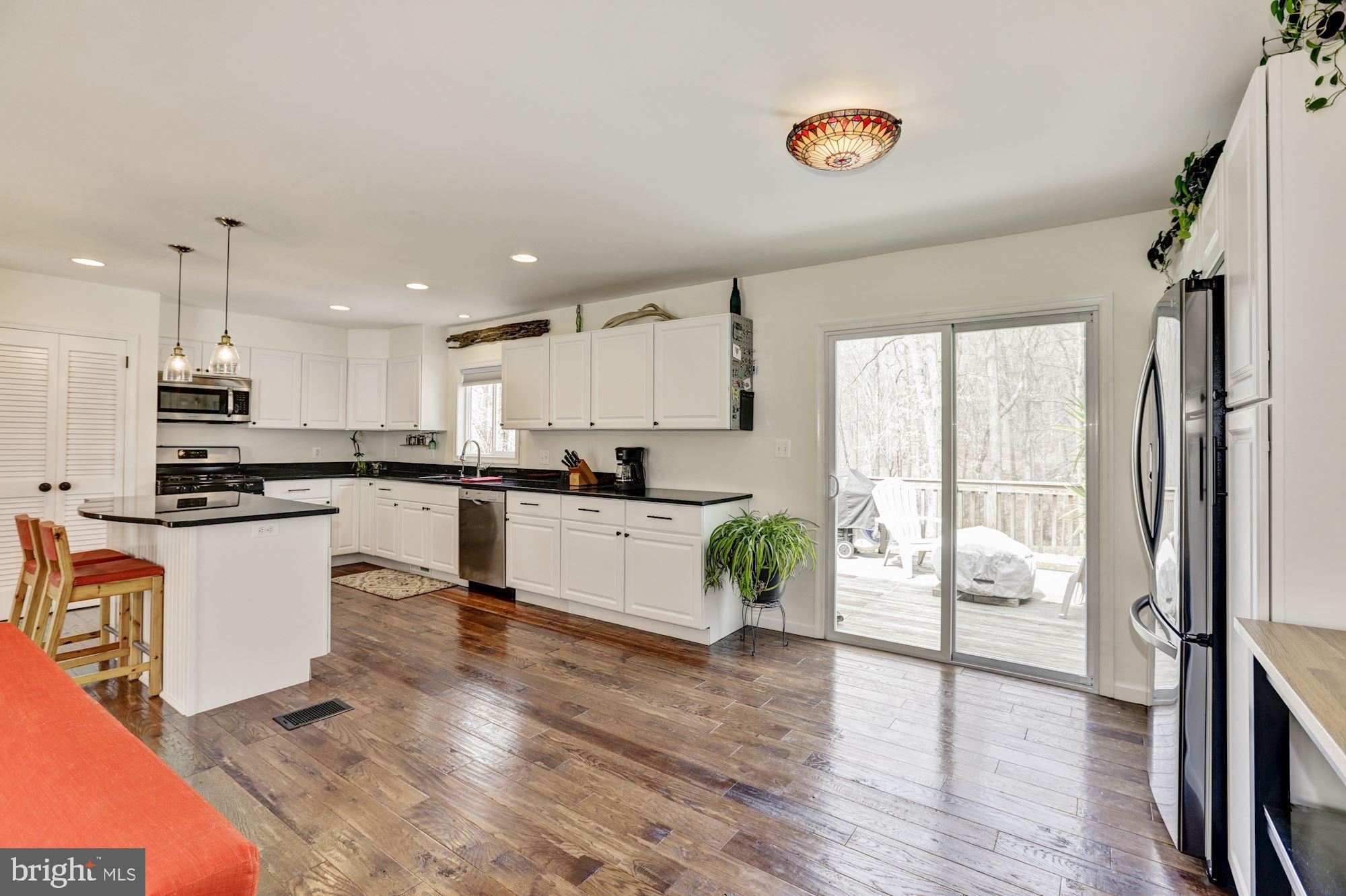 8026 Stillbrooke Road Manassas, VA 20112 - Photo 16 of 33 Open Kitchen to deck area