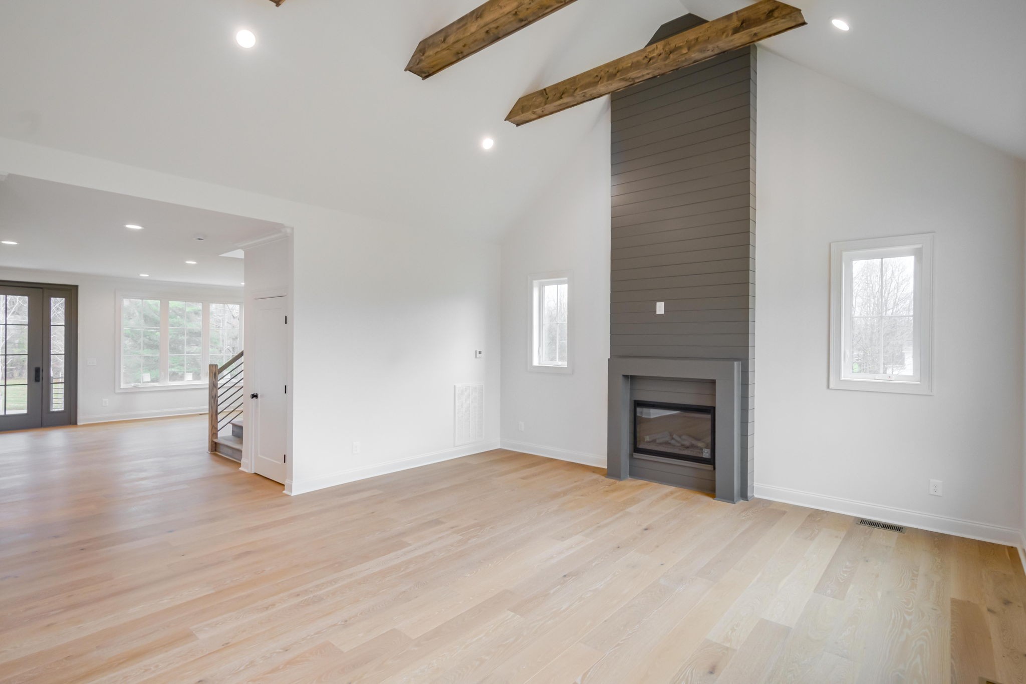 2235 Alvin Head Road Springfield, TN 37172 - Photo 4 of 31 an empty room with a fireplace and wooden floor
