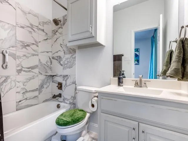 a bathroom with a sink a toilet and a bathtub