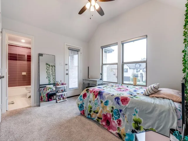 a bedroom with bed and windows