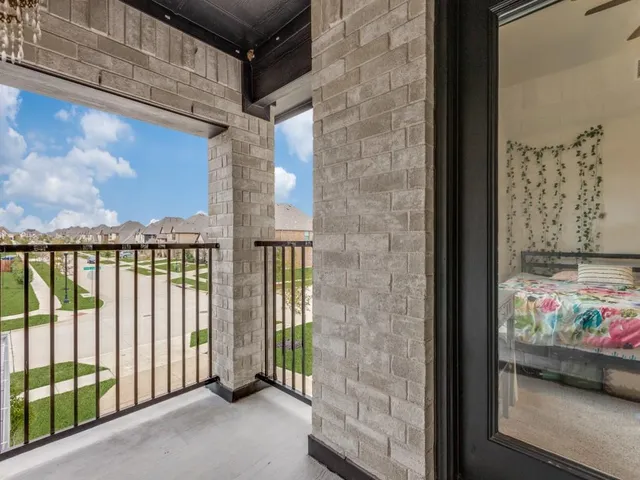 a view of a brick wall from a balcony