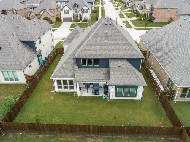 a aerial view of a house with swimming pool