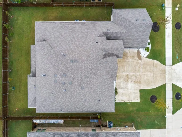 an aerial view of a house with a lake view