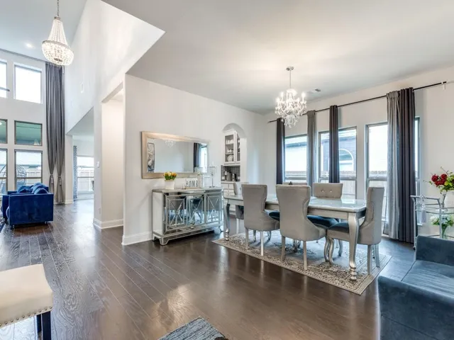 a living room with fireplace furniture and a wooden floor