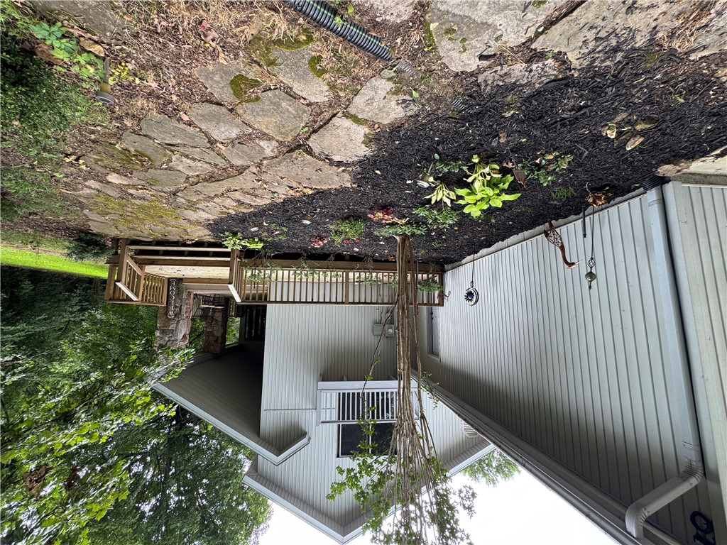 9643 Erbie Cutoff Road South Harrison, AR 72601 - Photo 36 of 41 rock walkway, flowerbed, deck and covered entry porch