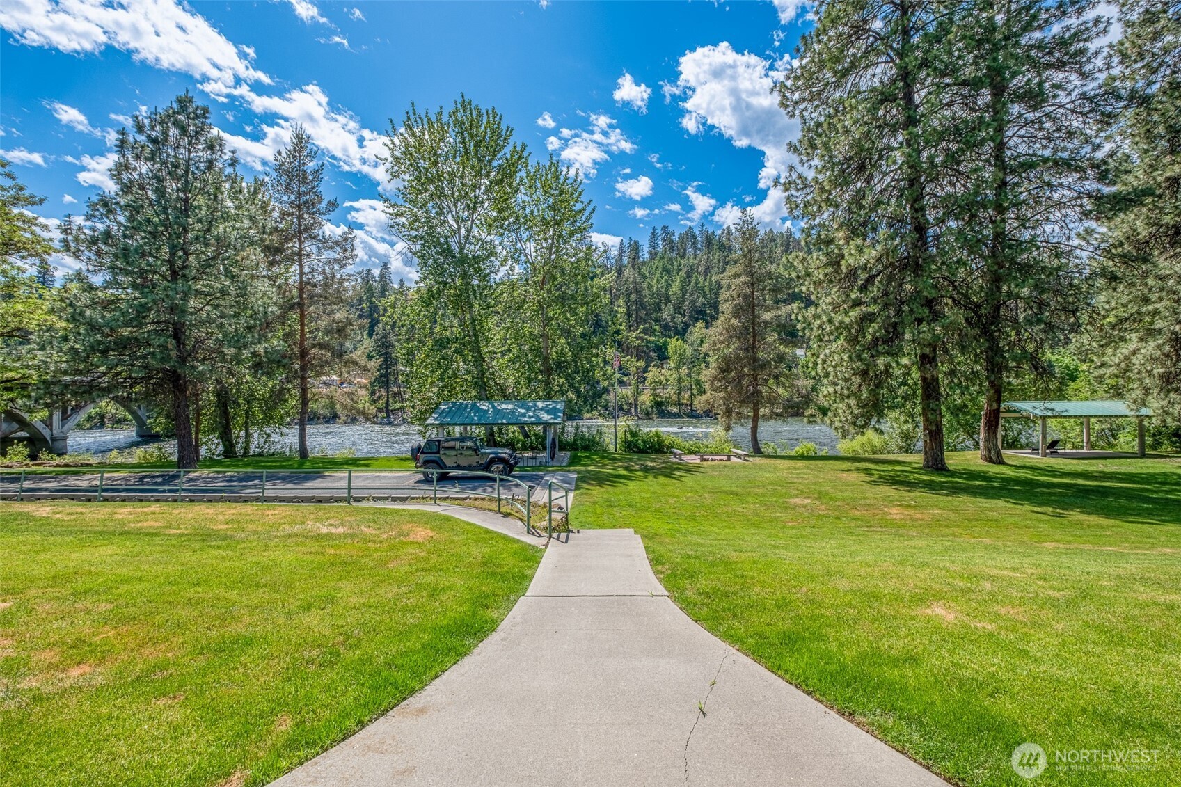 8348 Main Street, Unit 1 Peshastin, WA 98847 - Photo 2 of 40 a view of a swimming pool with a table and chairs