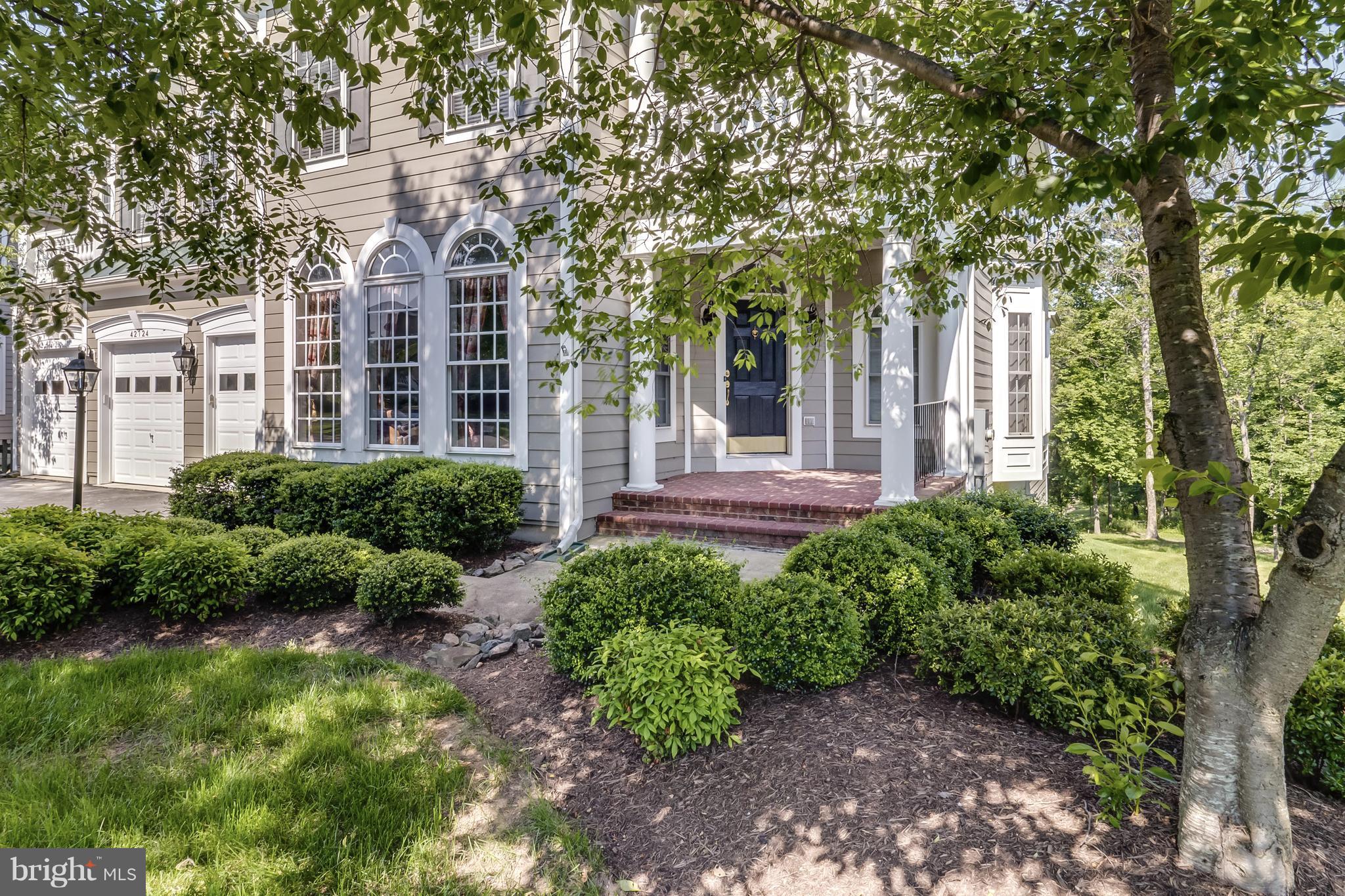 42724 Ridgeway Drive Broadlands, VA 20148 - Photo 2 of 30 a front view of a house with garden
