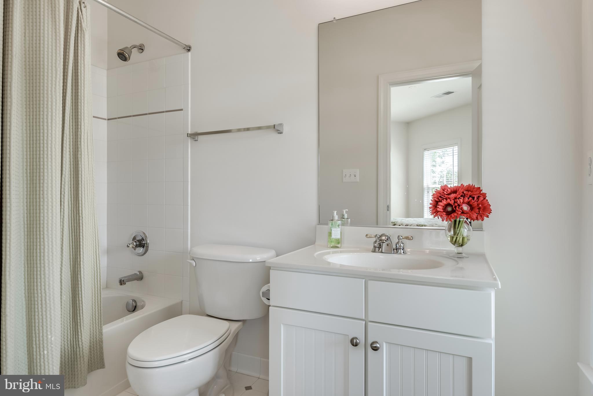 42724 Ridgeway Drive Broadlands, VA 20148 - Photo 19 of 30 a bathroom with a sink toilet vanity and shower
