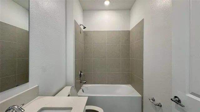 a bathroom with a bathtub and a toilet