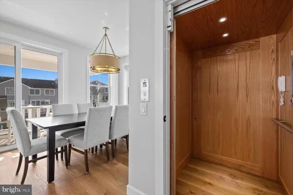 a dining room with furniture and window