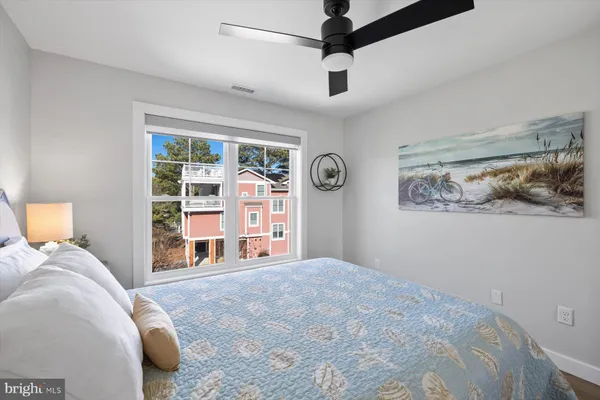 a bedroom with a large bed and a window