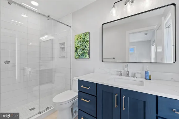 a bathroom with a toilet sink and shower