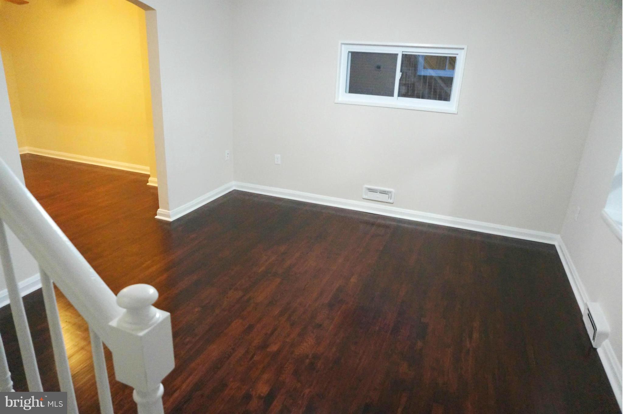 2011 Ormand Road Baltimore, MD 21222 - Photo 2 of 28 a view of an empty room with wooden floor