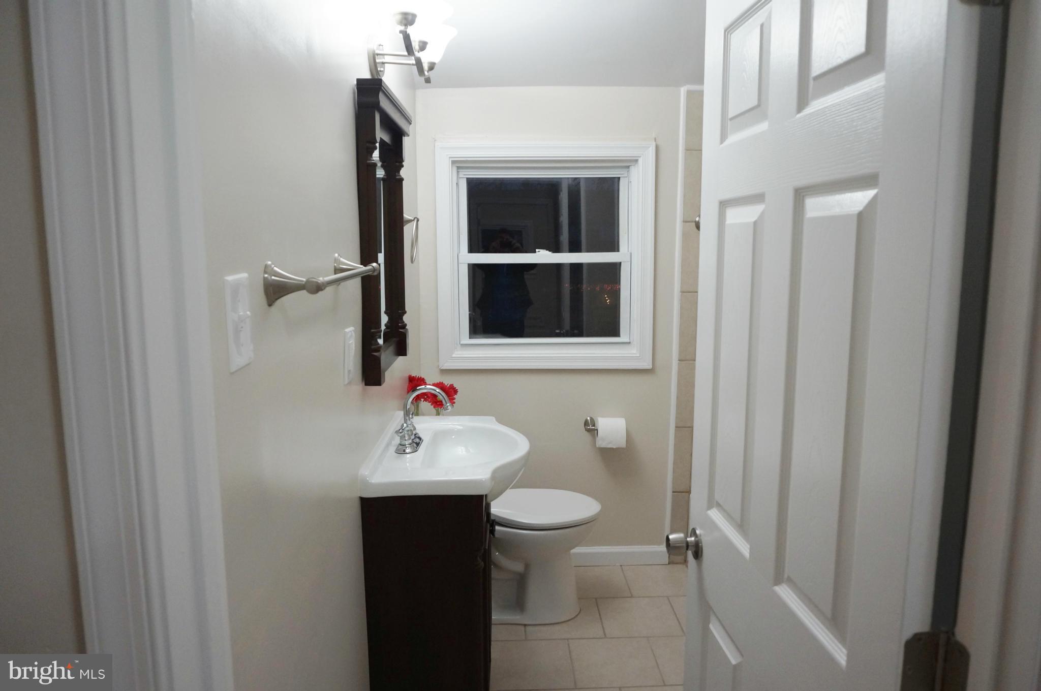 2011 Ormand Road Baltimore, MD 21222 - Photo 11 of 28 a bathroom with a sink toilet and shower
