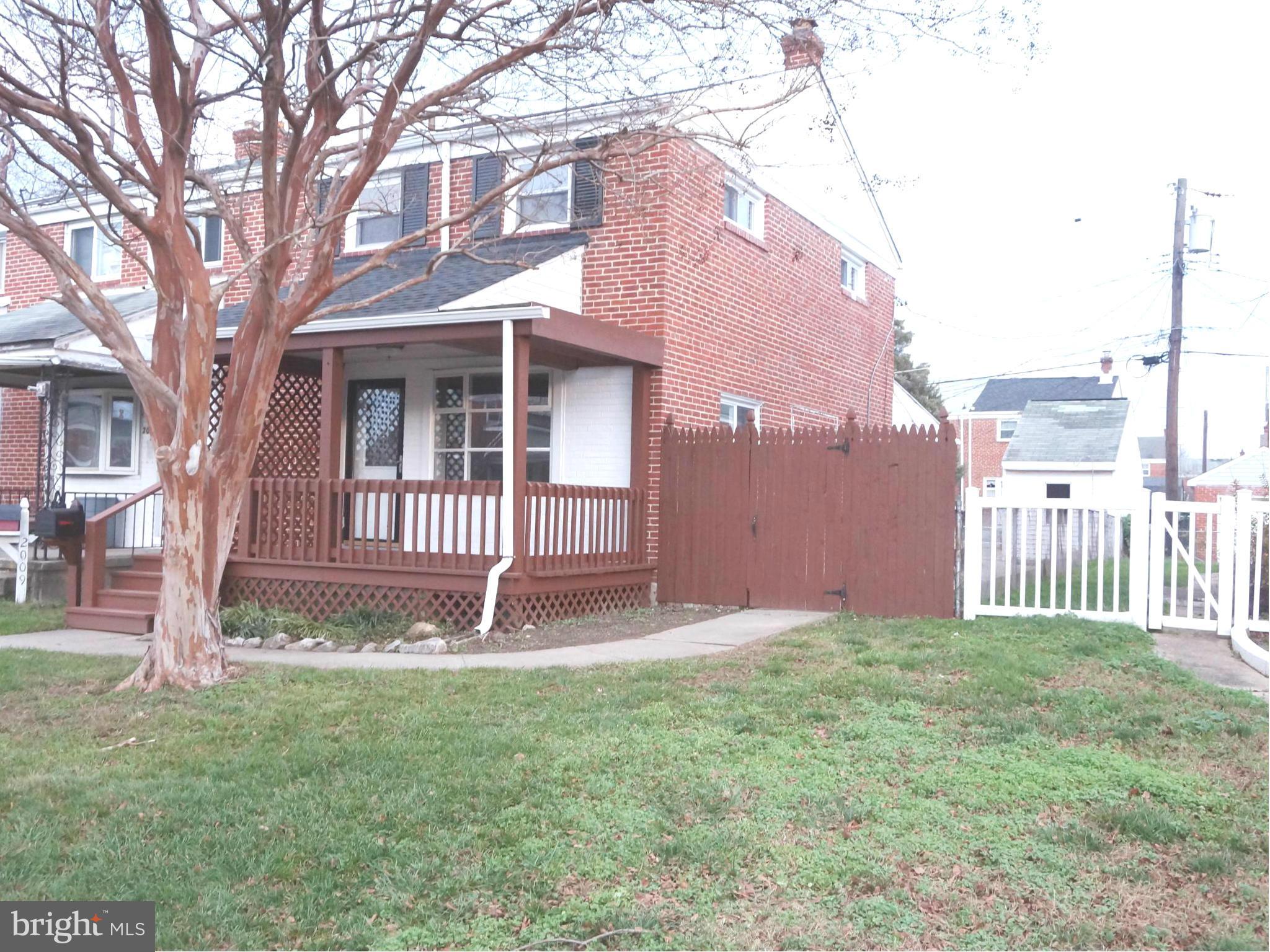 2011 Ormand Road Baltimore, MD 21222 - Photo 26 of 28 a front view of a house with a yard