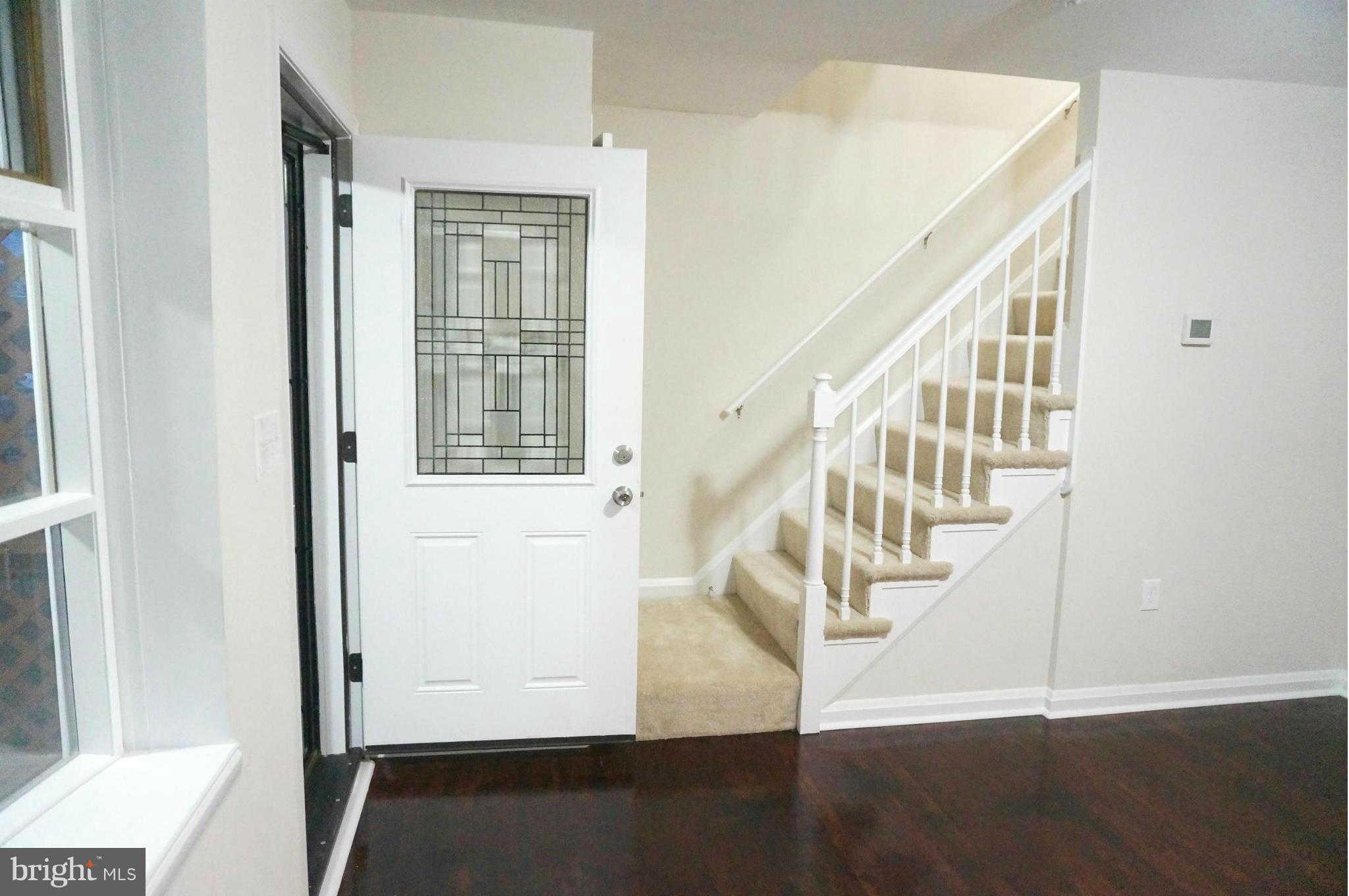 2011 Ormand Road Baltimore, MD 21222 - Photo 10 of 28 a view of entryway with wooden floor and stairs
