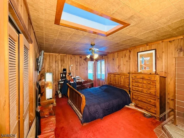 a bedroom with bed and window