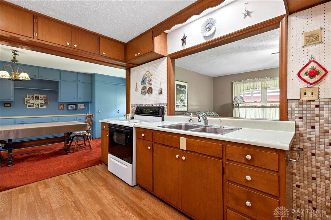 2470 Clark Run Road Xenia, OH 45385 - Photo 6 of 57 This spacious kitchen offers a pass-through window and ample cabinetry, perfect for entertaining.