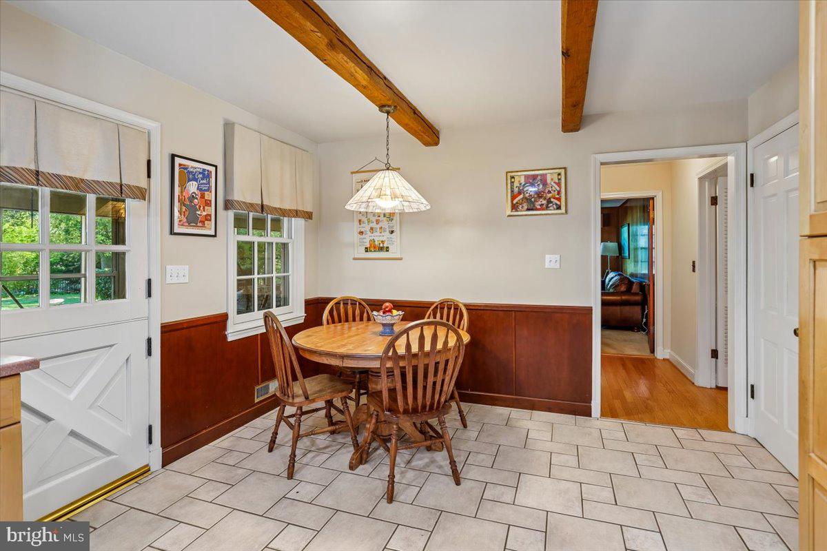 7918 Ruxway Road Towson, MD 21204 - Photo 13 of 36 a view of a dining room with furniture and chandelier