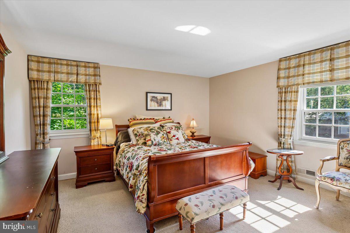7918 Ruxway Road Towson, MD 21204 - Photo 19 of 36 a bedroom with a bed and a window