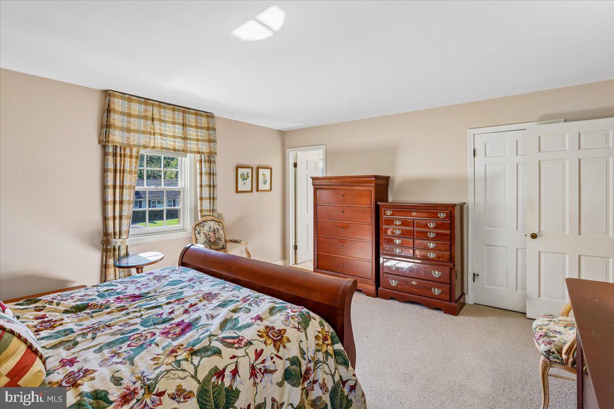 7918 Ruxway Road Towson, MD 21204 - Photo 20 of 36 a bedroom with a bed and a window